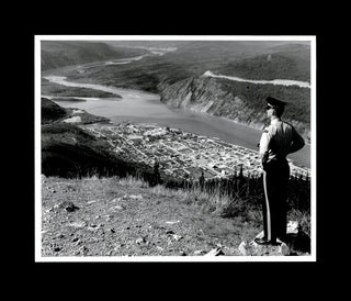 Item #4641 Photo of RCMP Officer Overlooking Dawson City in the Yukon Territory. Unknown...